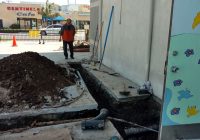 Plumbing Repairs out in the Parking Lot